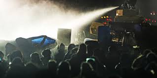 DOMESTIC TERRORISTS ASSAULT PEACEFUL ASSEMBLY WITH WATER CANNON